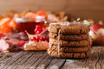 Fall harvesting on rustic wooden table with oat cookies