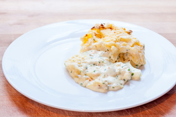 Fish pie served on a white plate