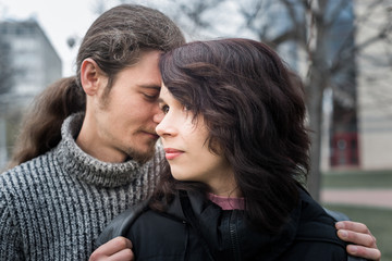 Fototapeta premium Close up portrait of attractive young couple standing outdoors.