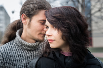 Fototapeta premium Close up portrait of attractive young couple standing outdoors.