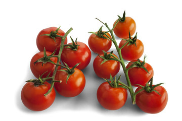 Red cherry tomatoes isolated on white.