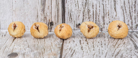 Dried fig over rustic wooden background