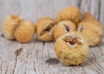 Dried fig over rustic wooden background