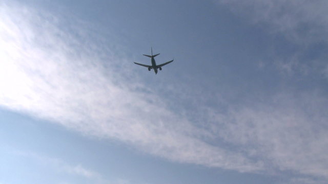 Plane descending from the clouds