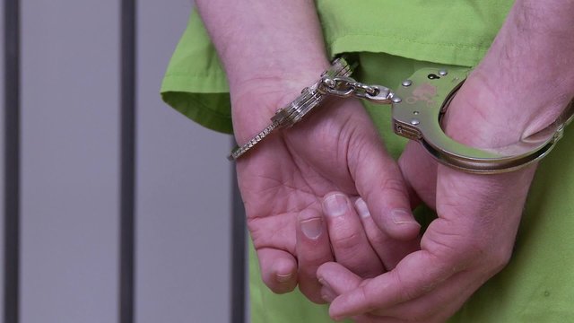 Guard Removes Inmates Handcuffs