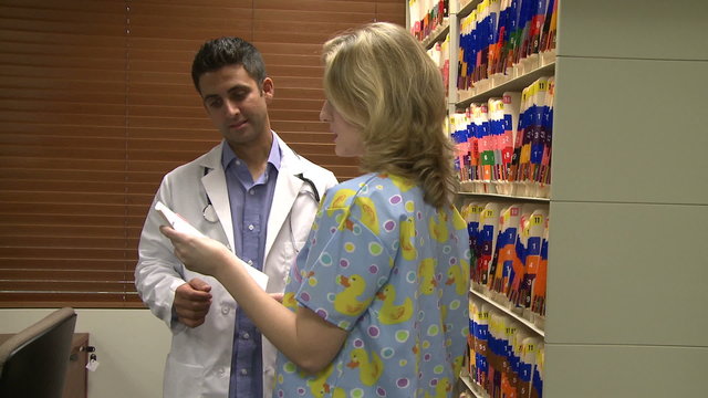 Doctor and nurse in filing room