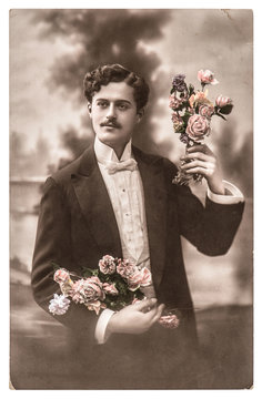 Vintage Portrait Of Young Man With Rose Flowers