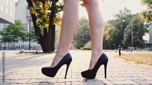 Sexy Woman Legs In Black High Heels Shoes Walking In The City Urban Street Steadicam Stabilized Shot In Slow Motion Lens Flare Sexy Woman Legs In Black High Heels Shoes Walking In The City Urban Street Steadicam Stabilized Shot In Slow Motion Lens Flare