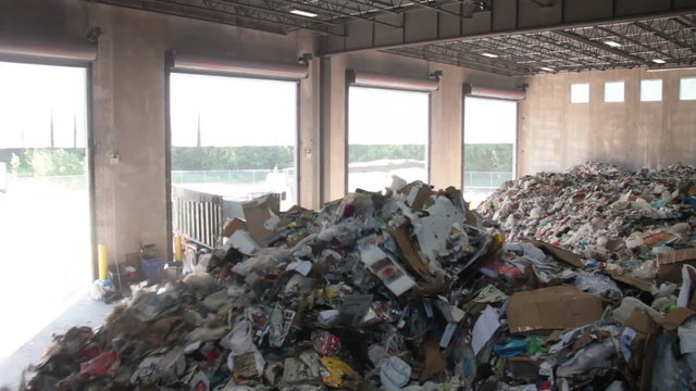 A Front End Loader Moves Trash at a Recycle Center