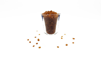 Pure Brown Sugar in Glass shot on white background