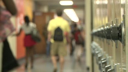 Close up of lockers with students in background