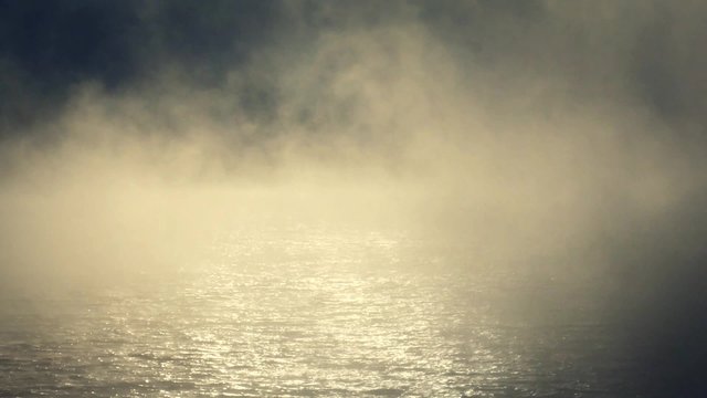 Foggy sunrise on the lake.
