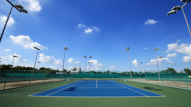4k Time-lapse of outdoor empty tennis court with blue sky and cloud