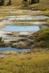 Fototapeta na wymiar Thermal pools and lime crust, Yellowstone National Park, Wyoming