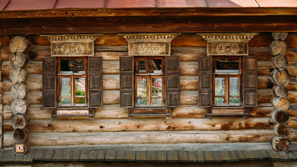 Windows, wall of the russian traditional wooden house in Suzdal,