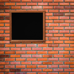 Fototapeta premium old wood frame on red brick wall background with space for text