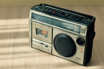 Dusty old radio with one cassette player