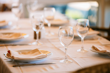 The interior of summer cafe - sheltered tables with white tablec