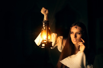 Fototapeta premium Beautiful Medieval Princess Holding Lantern 