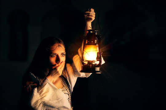 Scared Medieval Princess Holding Lantern 