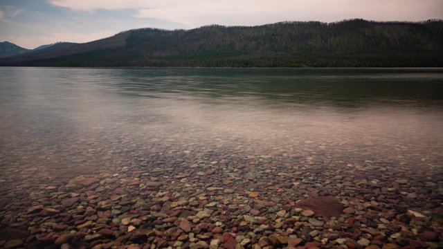 calm waters on lake mcdonald in glacier national park