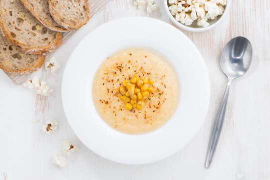 delicious corn soup and bread, top view