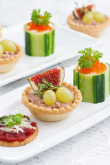Set of festive mini appetizers, closeup, vertical