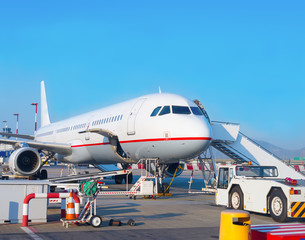 Fototapeta na wymiar Passenger plane in the airport. Aircraft maintenance.