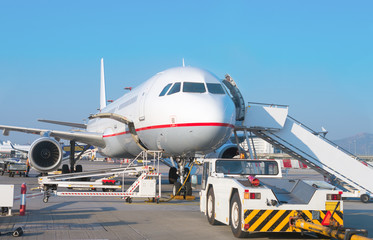 Fototapeta na wymiar Passenger plane in the airport. Aircraft maintenance.