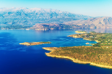 Aerial view of mountains and sea on peninsula.
