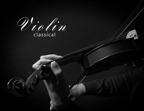 Violinist playing violin. Black and white photo