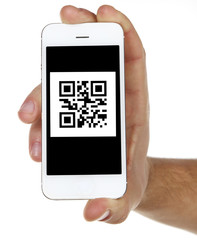 Hand holding smart phone with QR code on screen