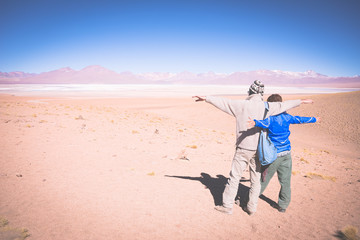 Couple traveling on the Bolivian Andes, toned image