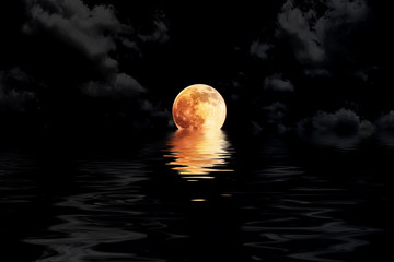dark red full moon in cloud with water reflection closeup showin