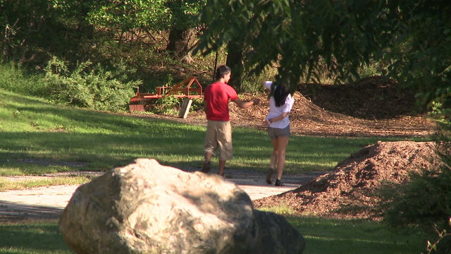 Boy and girl walking in country