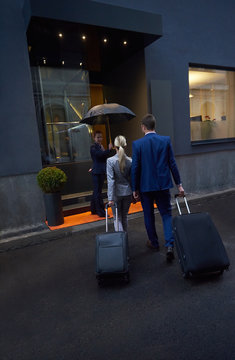 Business People Couple Entering  Hotel