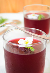 Red wine jelly with white flowers and ice