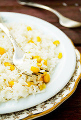 basmati rice in white plate witn sweet corn