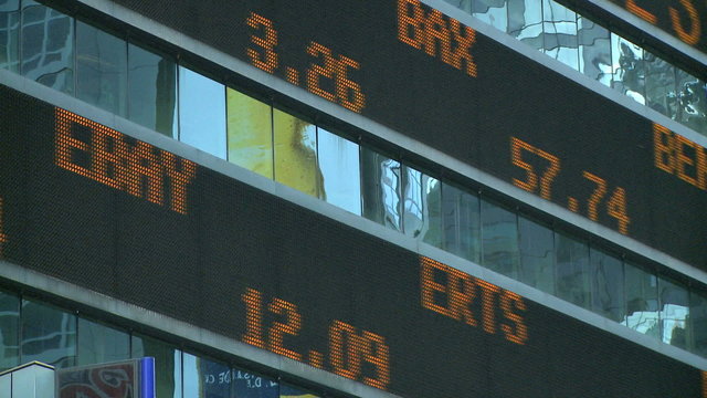 A stock ticker scrolls near times square