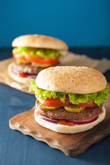burger with beef patty lettuce onion tomato ketchup