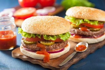 burger with beef patty lettuce onion tomato ketchup