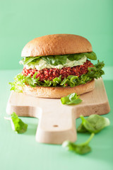 veggie beet and quinoa burger with avocado dressing