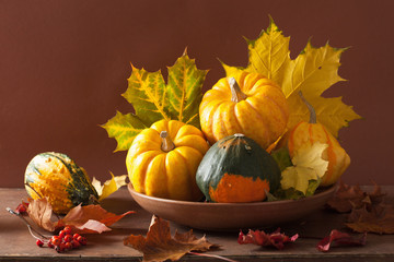 Naklejka na ściany i meble decorative pumpkins and autumn leaves for halloween