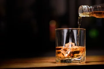 Fotobehang Still life. pour or whiskey in to glass © chettythomas