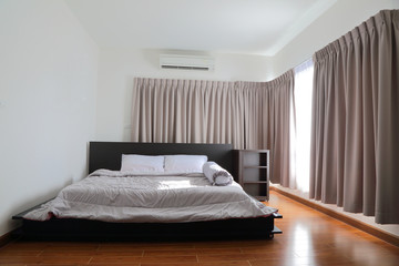 beautiful bedroom with light shining through the window