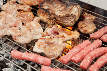 Chicken and sausages on the barbecue