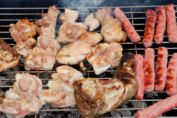 Chicken and sausages on the barbecue