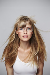 Beautiful blond student in glasses, portrait