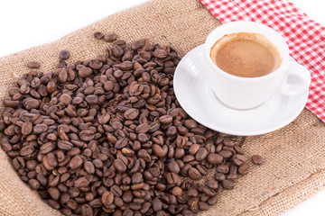 Cup of coffee with coffee beans