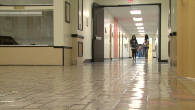 Student coming out of classroom into hallway